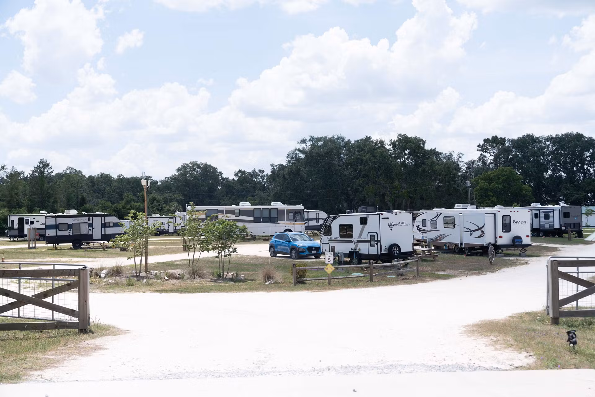 RV park ground with several vehicles